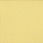 Andover - 830-Y2 - Stof met stippen. Kleine witte stipjes op een lichtgele ondergrond. 
